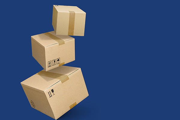 3-D images of stacked shipping boxes falling with a dark blue background